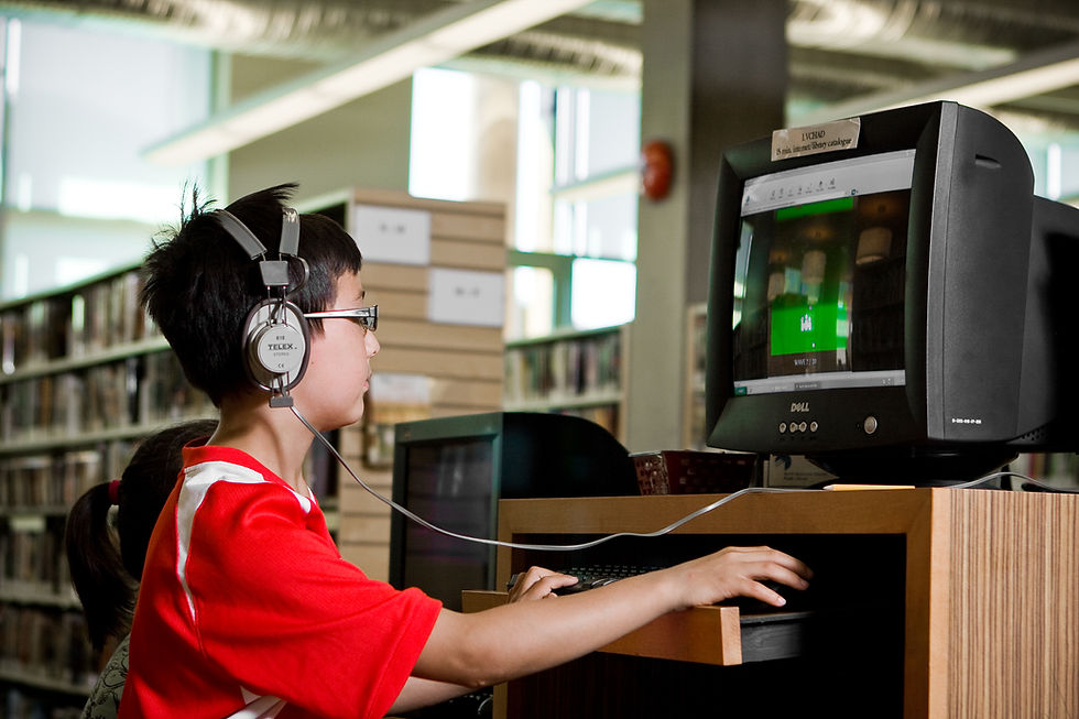 A young boy sits infront of a computer screen at the opening of the new Lynn Valley Library, which opened in 2007.